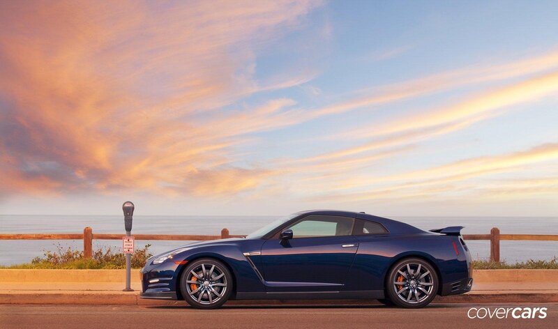 Blue sports car at sunset