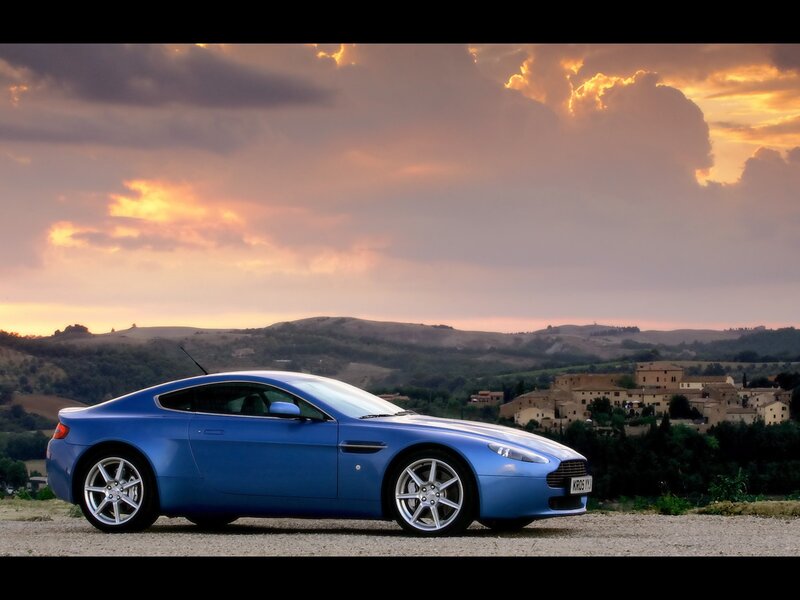 Blue sports car at sunset