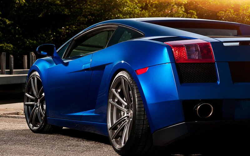 blue sports car at sunset
