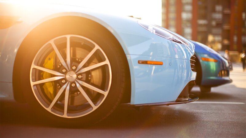 blue sports car at sunset