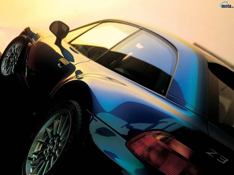 blue sports car at sunset