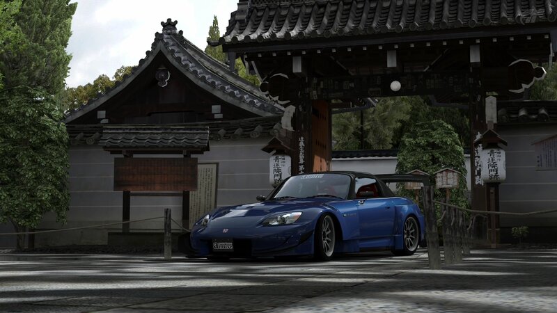 Blue sports car at temple gate