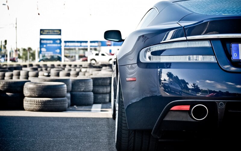 blue sports car at tire shop
