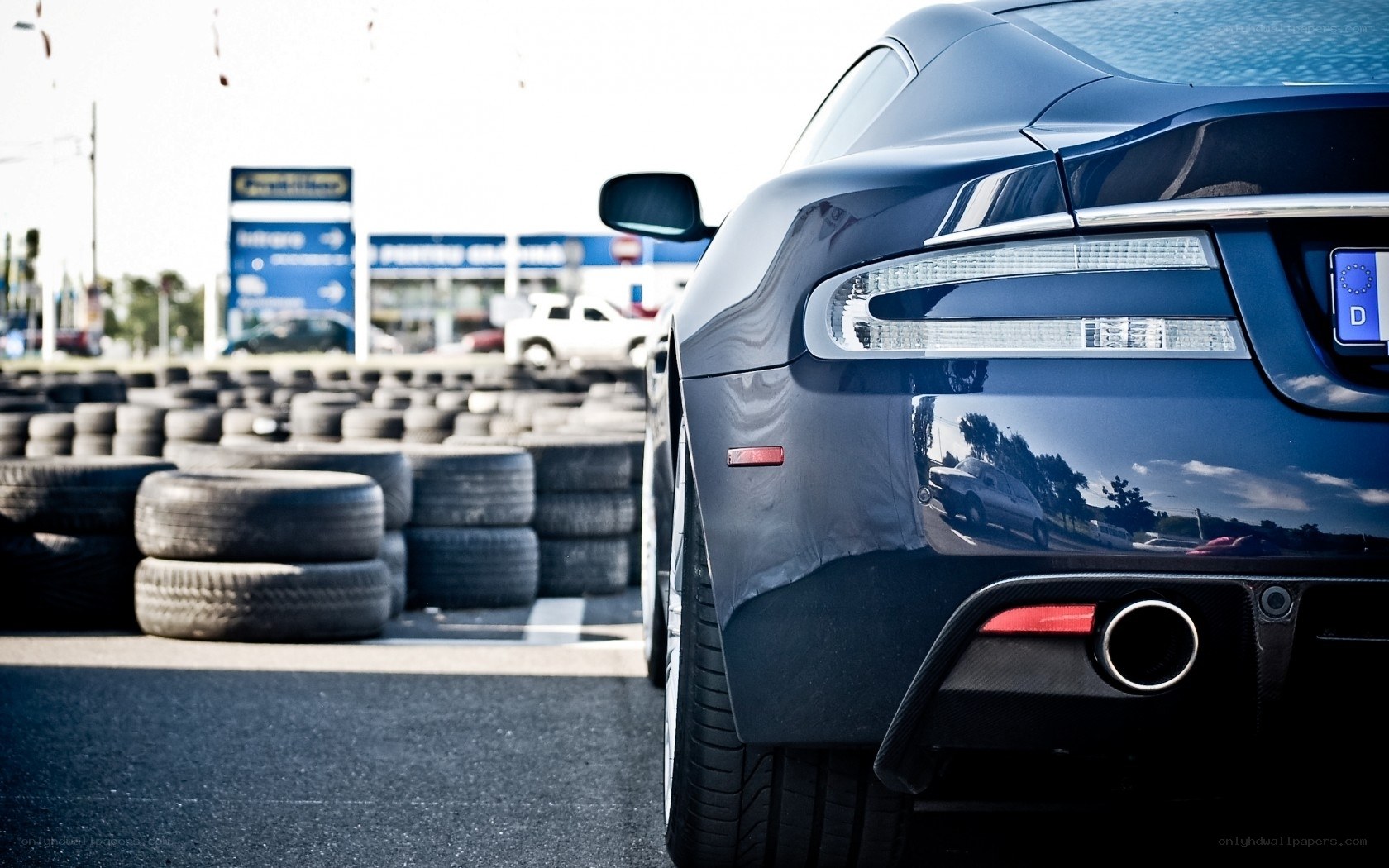 blue sports car at tire shop