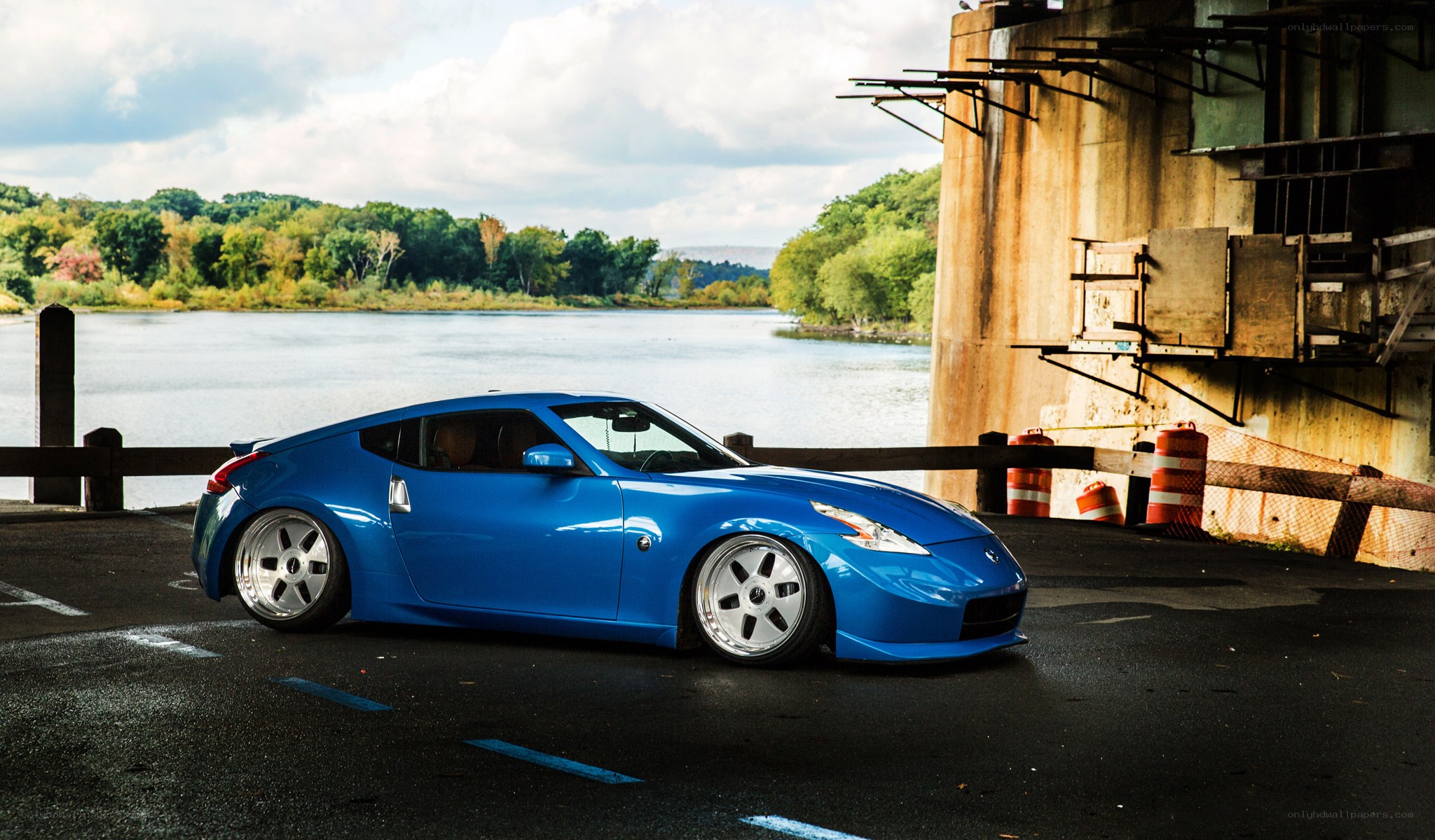 Blue sports car by the river