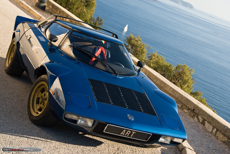 Blue sports car by the sea
