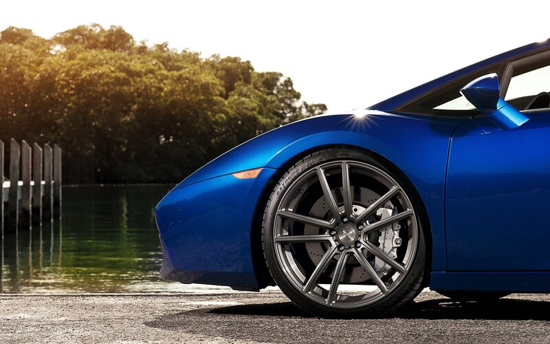 Blue sports car by the water