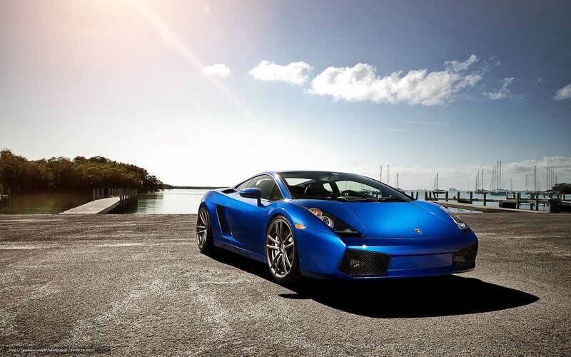 Blue sports car by the water