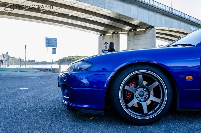Blue Sports Car — Calm, Afternoon, Photograph, Couple