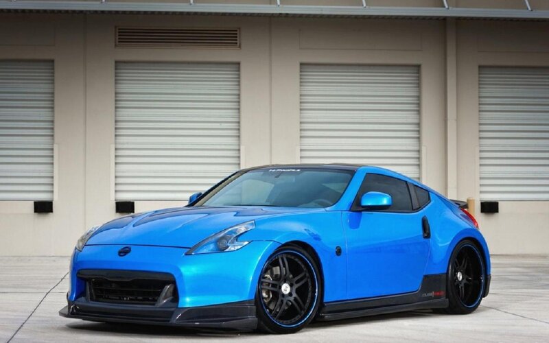 Blue Sports Car — Calm, Afternoon, Photograph, Garage Doors