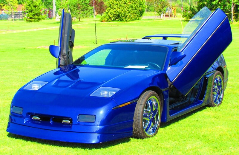 Blue Sports Car — Calm, Afternoon, Photograph, Grass