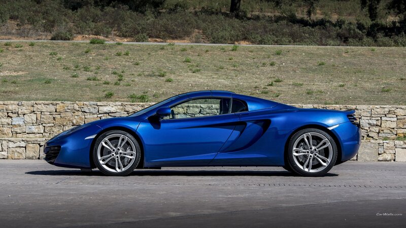 Blue Sports Car — Calm, Afternoon, Photograph, Stone Wall