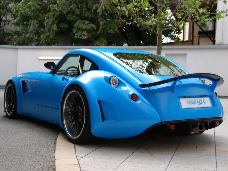 Blue Sports Car — Calm, Afternoon, Photograph, Tree, Wall