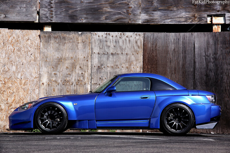 Blue Sports Car — Calm, Afternoon, Photograph, Wooden Wall