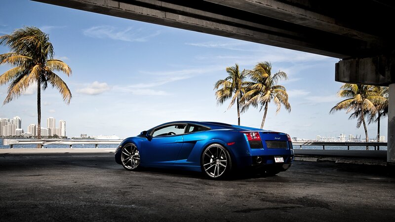 Blue Sports Car — City Skyline