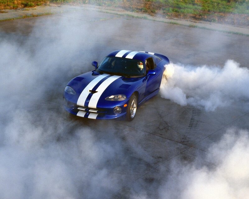 Blue sports car doing burnout