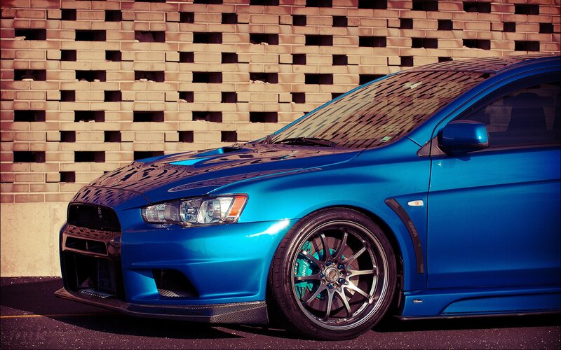Blue Sports Car — Dramatic, Afternoon, Photograph, Brick Wall