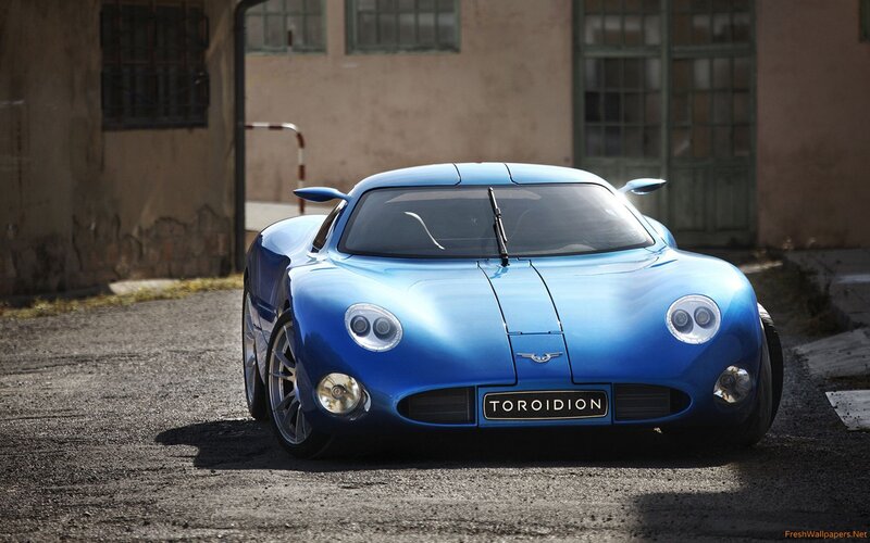 Blue Sports Car — Dramatic, Afternoon, Photograph, Building, Asphalt