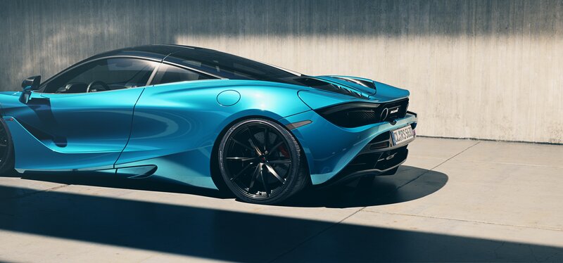 Blue Sports Car — Dramatic, Afternoon, Photograph, Concrete Wall, Black Wheels
