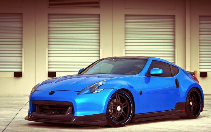 Blue Sports Car — Dramatic, Afternoon, Photograph, Garage Doors, Black Wheels