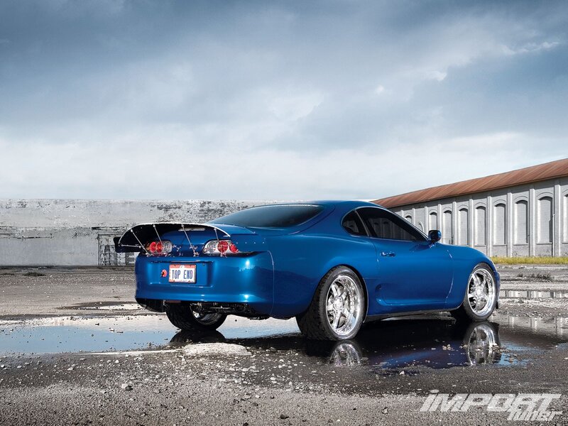 Blue Sports Car — Dramatic, Afternoon, Photograph, Puddle