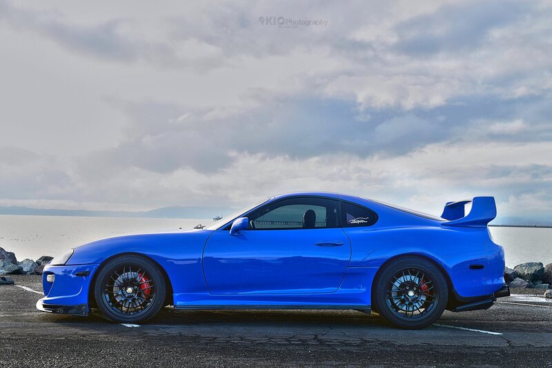 Blue Sports Car — Dramatic, Afternoon, Photograph, Sea