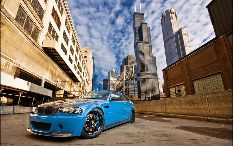 Blue Sports Car — Dramatic, Afternoon, Photograph, Skyscrapers