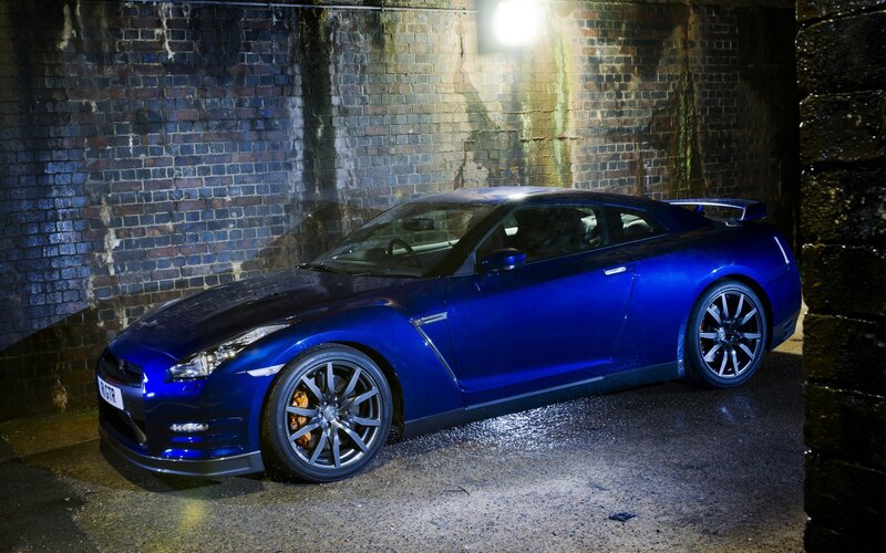 Blue Sports Car — Dramatic, Night, Photograph, Brick Wall