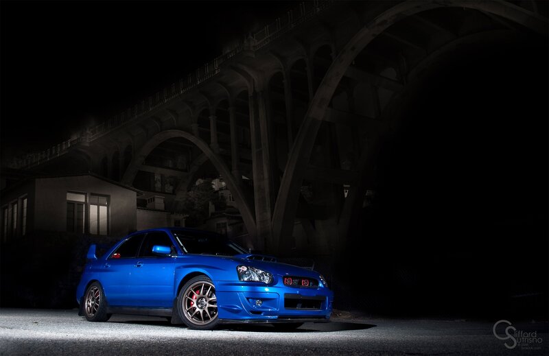 Blue Sports Car — Dramatic, Night, Photograph, Bridge, Building