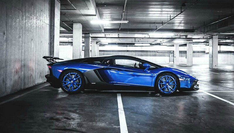 Blue Sports Car — Dramatic, Photograph, Parking Garage, Concrete Pillars
