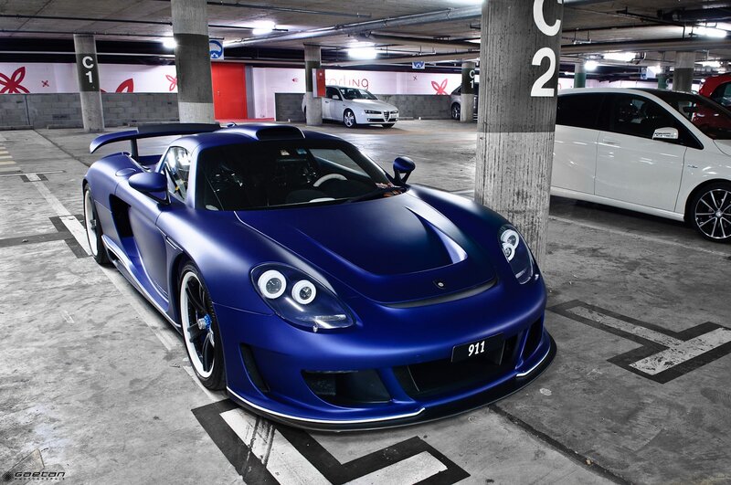 Blue Sports Car — Dramatic, Photograph, Parking Garage, White Car