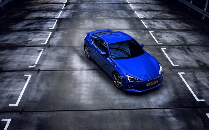 Blue Sports Car — Dramatic, Photograph, Parking Lot, Concrete Floor