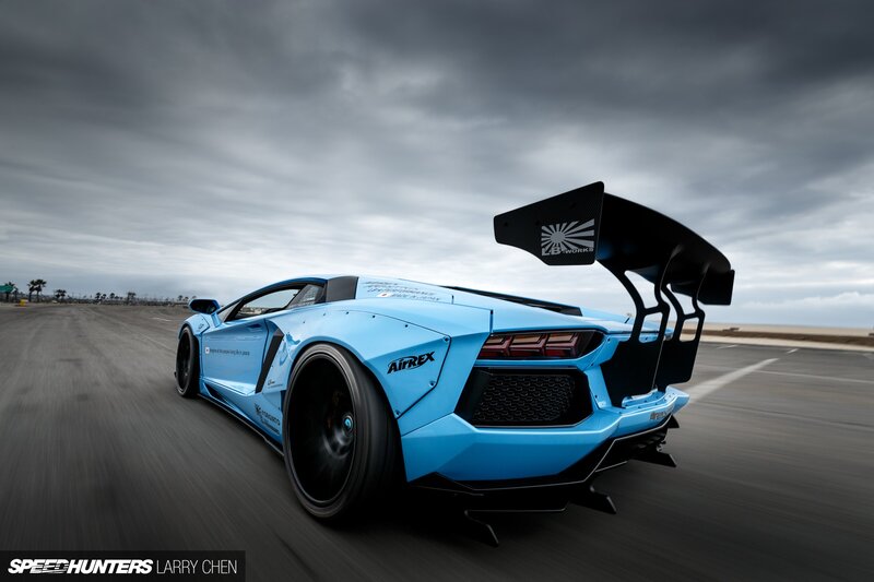 Blue Sports Car — Dramatic, Photograph, Race Track
