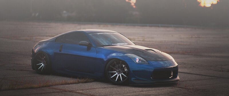 Blue Sports Car — Dramatic, Sunset, Photograph, Asphalt, Flames