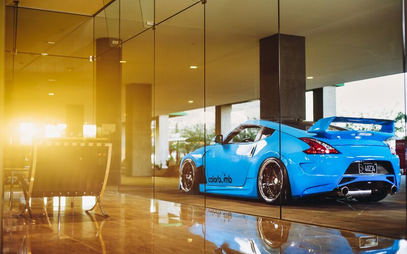 Blue Sports Car — Dramatic, Sunset, Photograph, Glass Walls