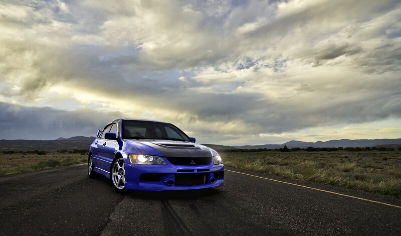 Blue Sports Car — Dramatic, Sunset, Photograph, Road, Mountains, Clouds