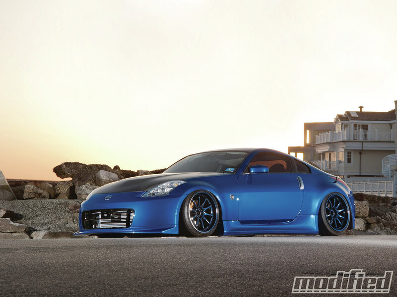 Blue Sports Car — Dramatic, Sunset, Photograph, Rocks