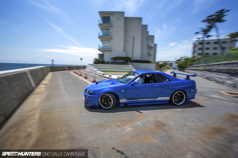 Blue Sports Car — Dynamic, Afternoon, Photograph, Building, Ocean