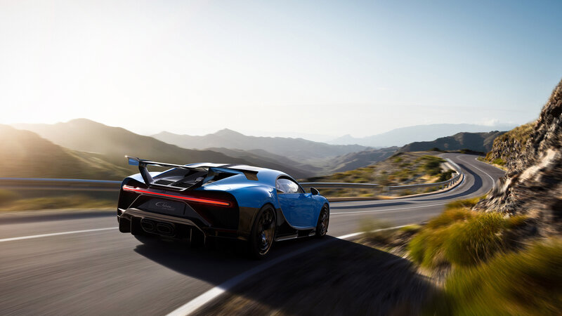 Blue Sports Car — Dynamic, Afternoon, Photograph, Mountain Road, Sunlight