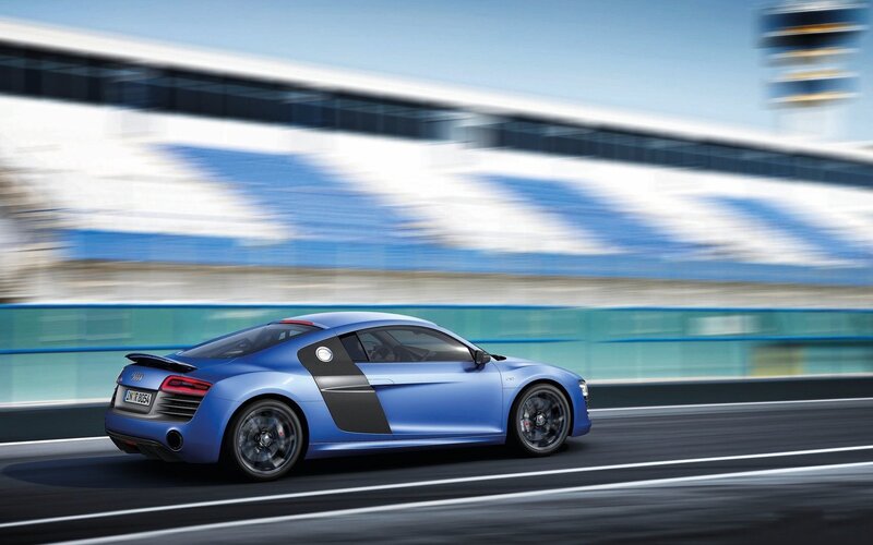 Blue Sports Car — Dynamic, Afternoon, Photograph, Race Track, Building