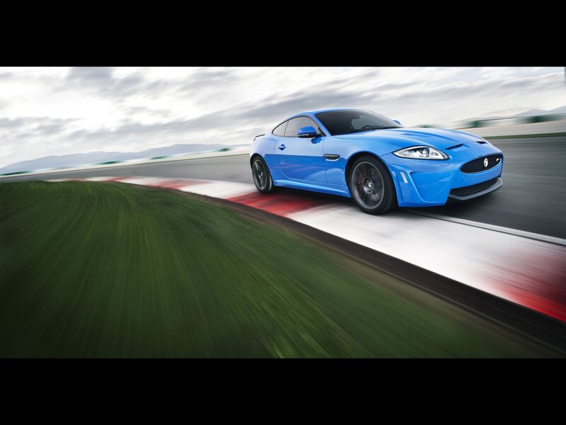 Blue Sports Car — Dynamic, Afternoon, Photograph, Race Track, Grass