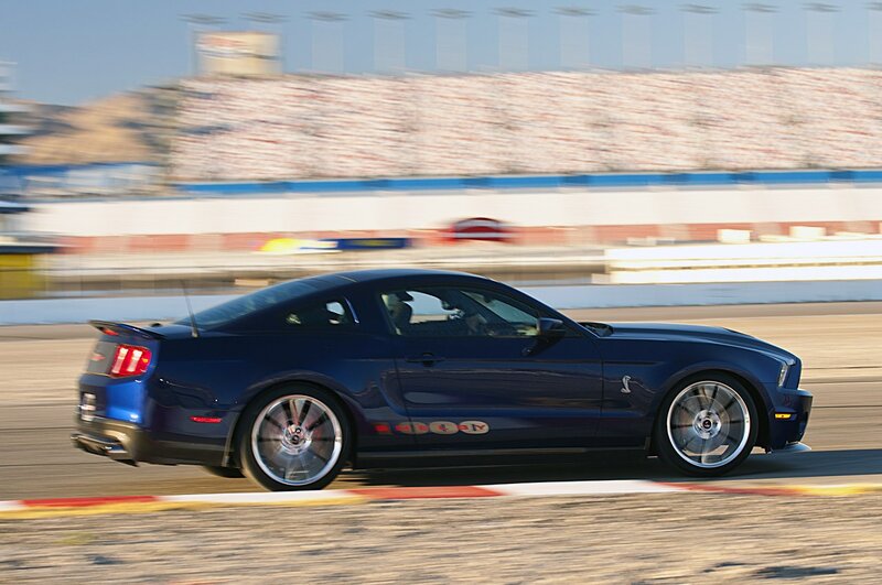 Blue Sports Car — Dynamic, Afternoon, Photograph, Racetrack, Stadium