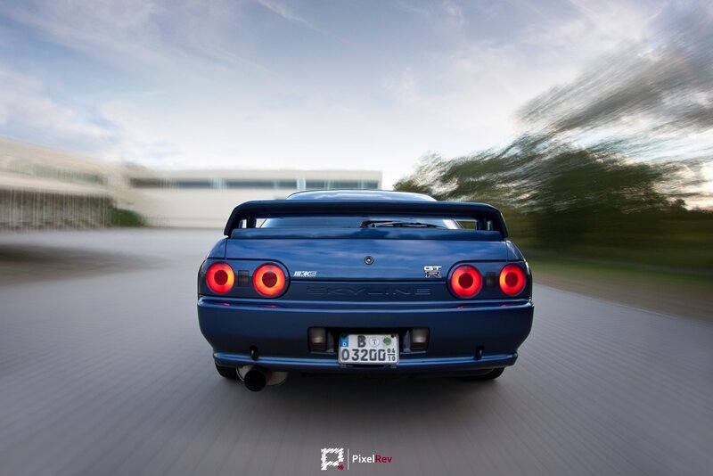 Blue Sports Car — Dynamic, Afternoon, Photograph, Road, Building