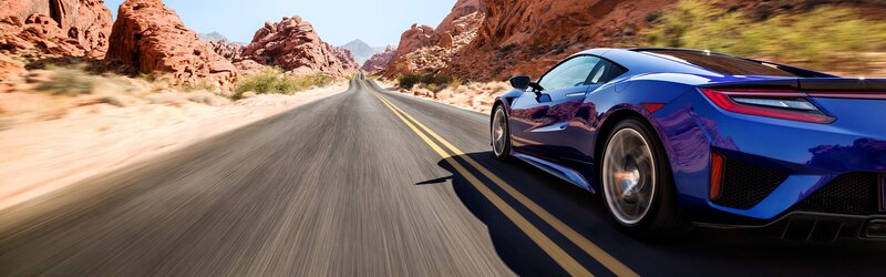 Blue Sports Car — Dynamic, Afternoon, Photograph, Road, Rock Formations