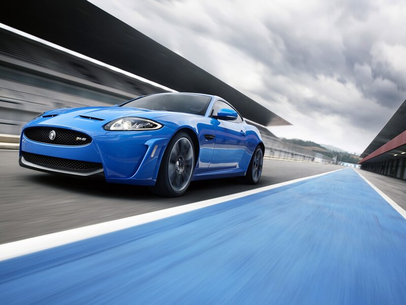 Blue Sports Car — Dynamic, Photograph, Race Track, Cloudy Sky