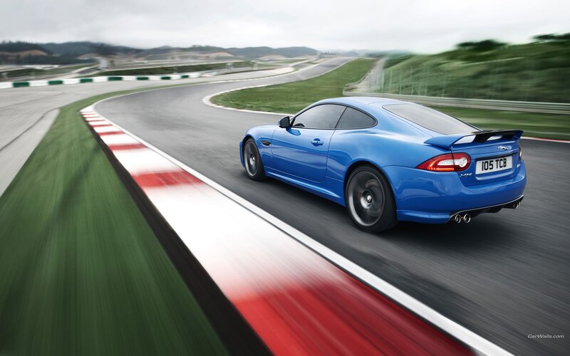 Blue Sports Car — Dynamic, Photograph, Race Track, Curved Road