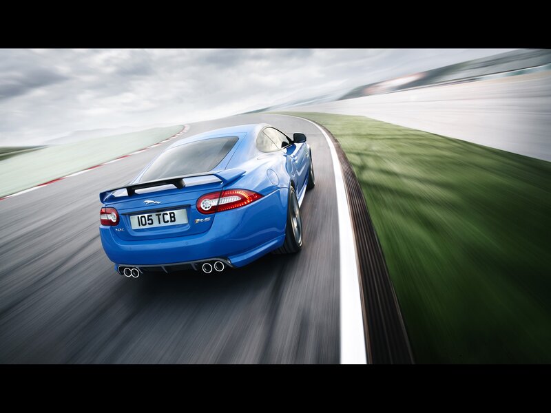 Blue Sports Car — Dynamic, Photograph, Race Track, Grass