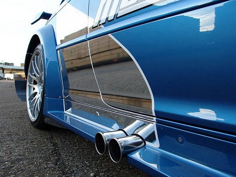 blue sports car exhaust