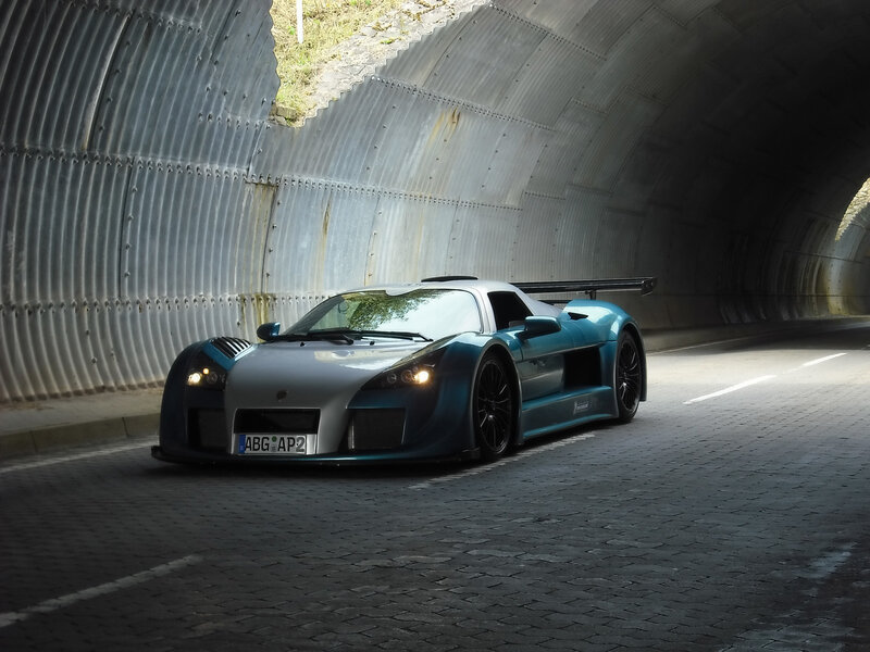 Blue sports car in a tunnel