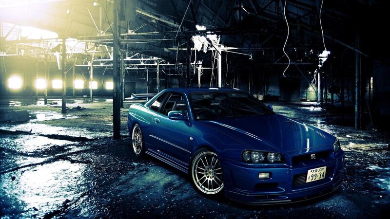 Blue sports car in abandoned warehouse